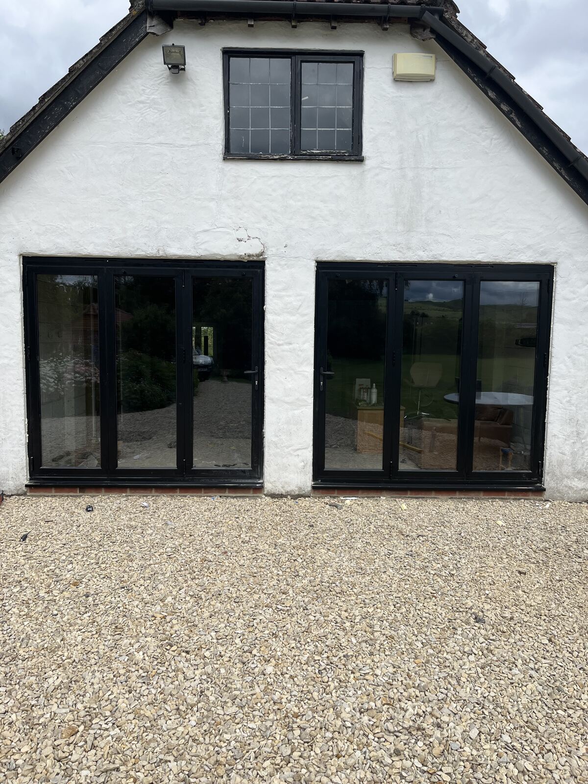 White aluminium bi-fold doors on a garage conversion